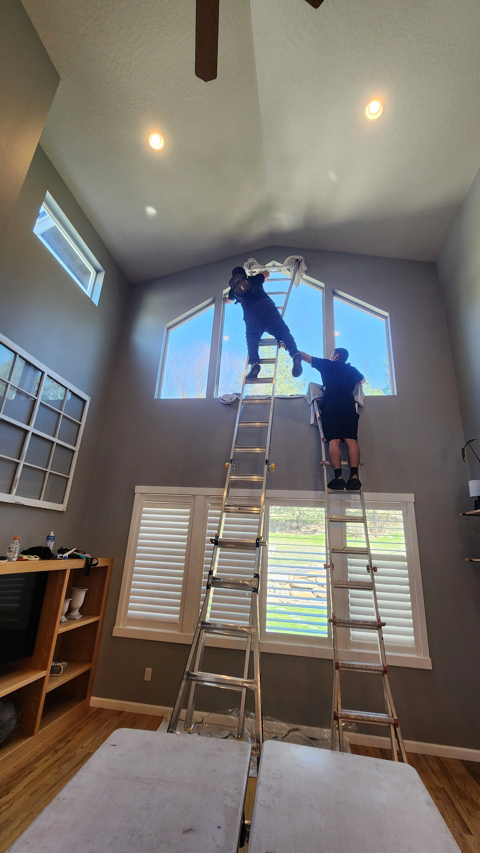 509 Tint Customs installers working on high residential windows from ladders