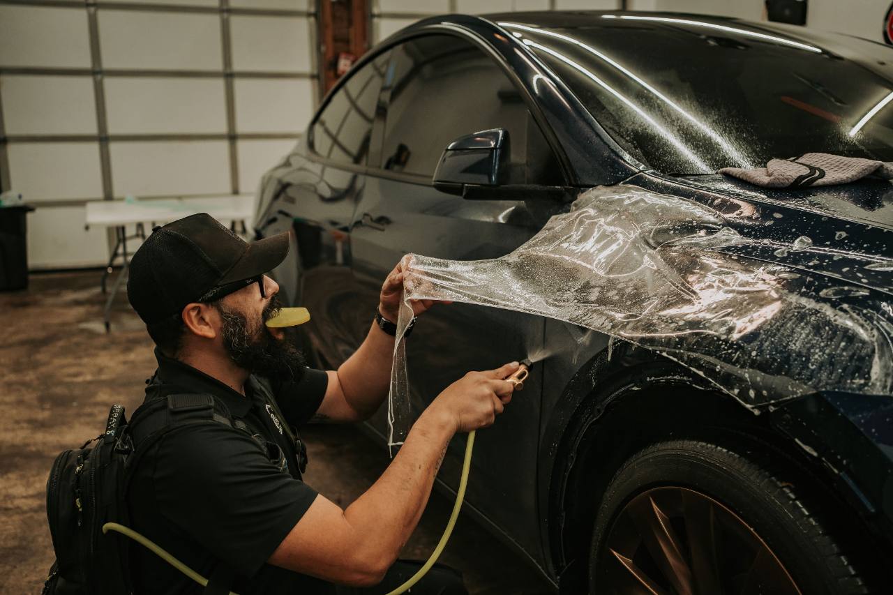 509 Tint Customs installer applying clear paint protection film